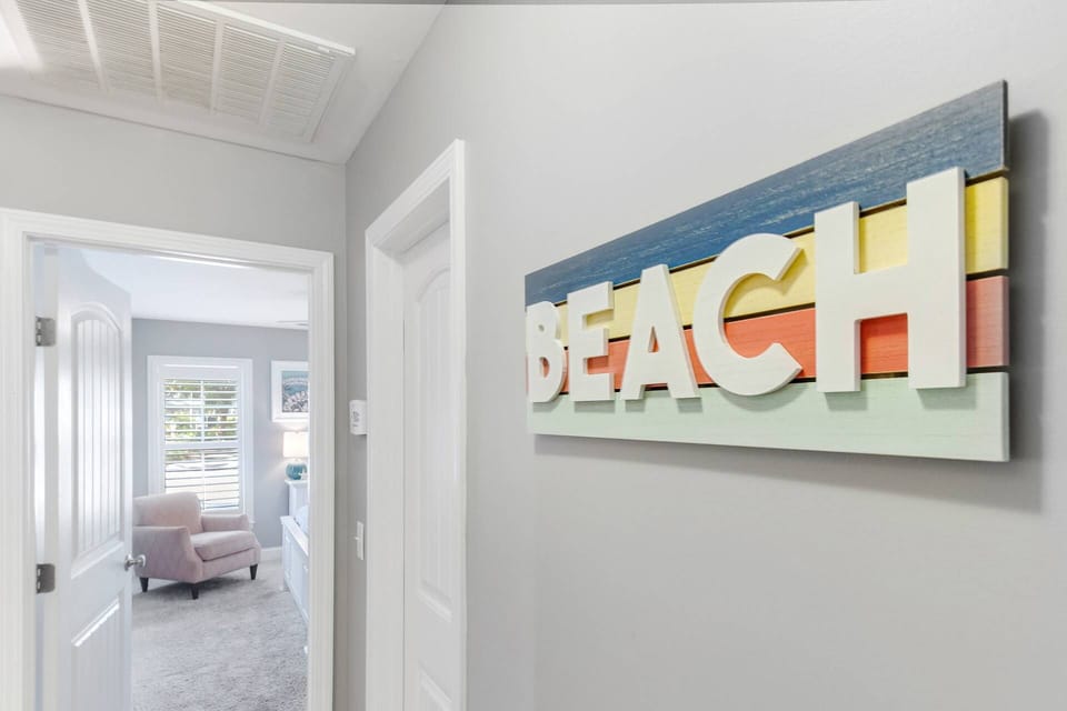 You are finally at the BEACH & it is Time to Relax! Hall Bath on the right & Bedroom #2 in the background,