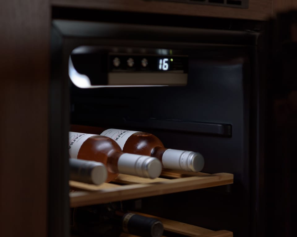 The kitchen also features a wine fridge.
