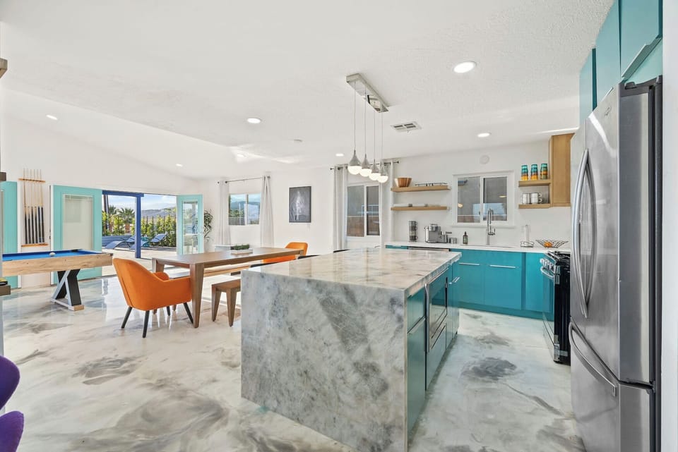 Kitchen is perfectly centered in the home and open to all living areas.