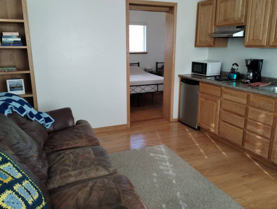 Sky Harbor Cabin Kitchenette – Equipped with Microwave, Toaster, 12-Cup Drip Coffee Maker, Tea Kettle, Coffee, Creamer, Sugar, Tea, Filters, and Basic Cooking Essentials.