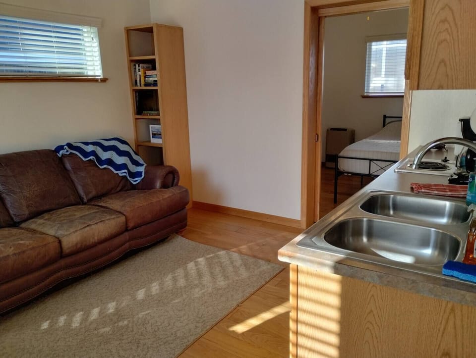 Sky Harbor Cabin - Kitchenette – Equipped with Microwave, Toaster, 12-Cup Drip Coffee Maker, Tea Kettle, Coffee, Creamer, Sugar, Tea, Filters, and Basic Cooking Essentials.