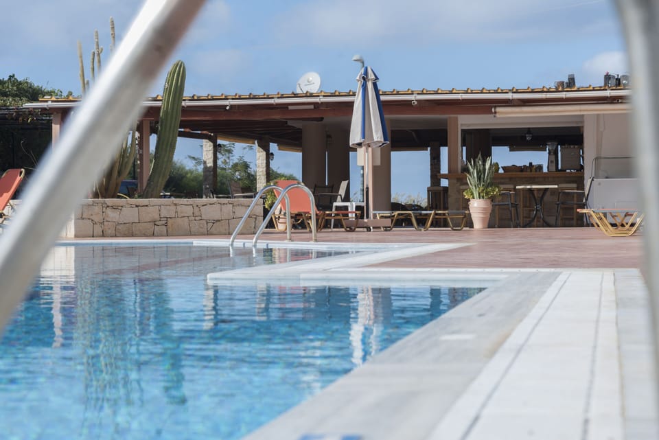 Seasonal outdoor pool, open 8:00 AM to 8:00 PM, sun loungers