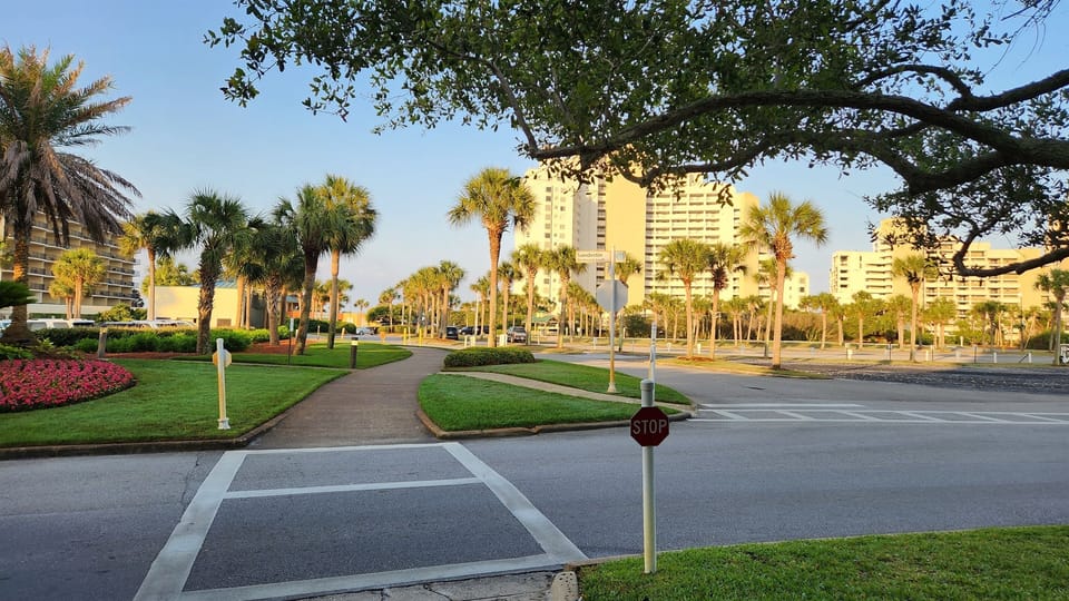 Tram stop and Walking path to the beach past the pool