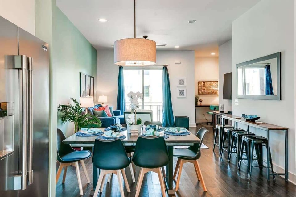 Dining room opens straight to the living area; whoever's cooking keeps the conversation going while the group settles in