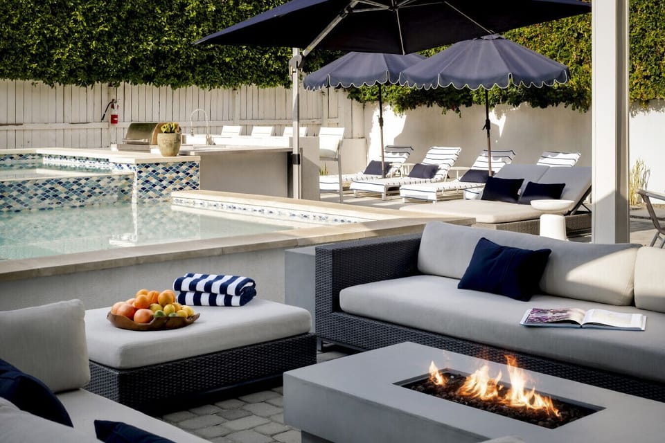 Unwind by the fire pit with a poolside view.