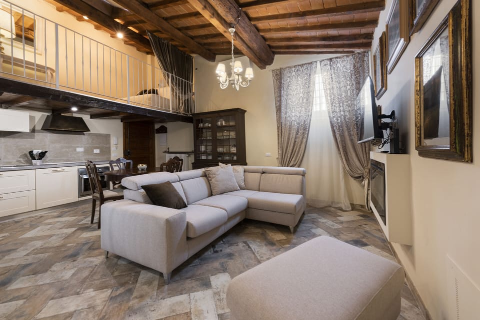 Deluxe Apartment | Living area | 40-inch flat-screen TV with digital channels, TV