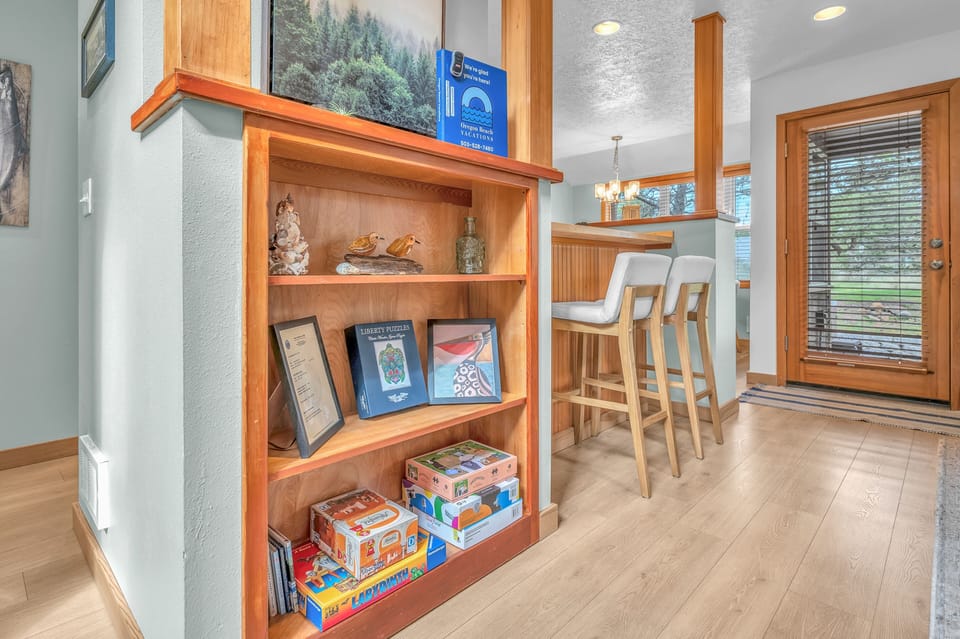 Gather around the kitchen island for morning coffee while the kids explore games and puzzles from the thoughtful built-in shelving.