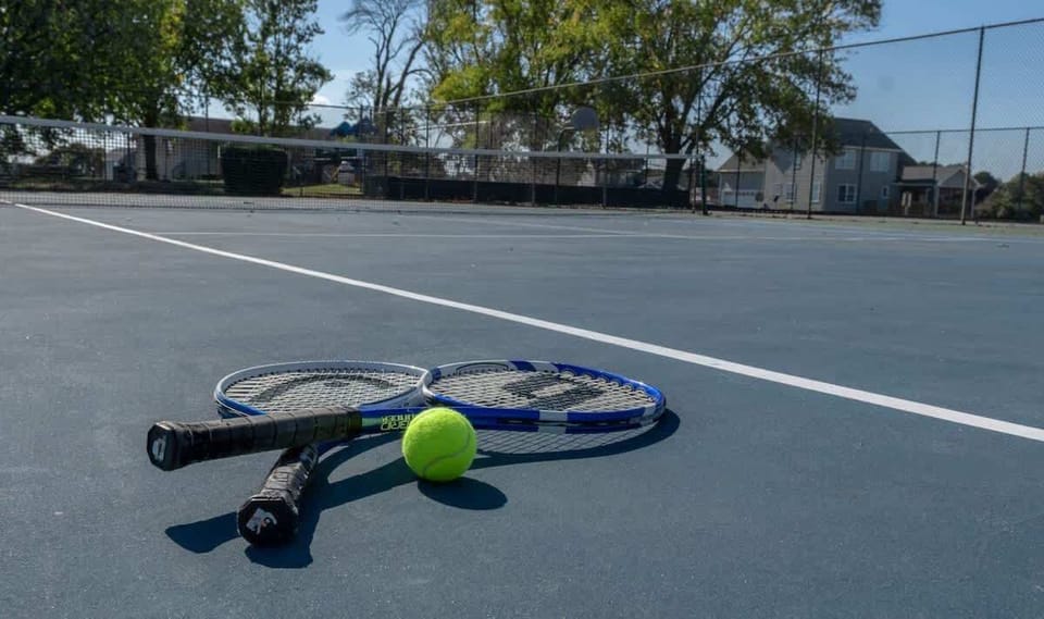 Enjoy a friendly match on the community tennis court.