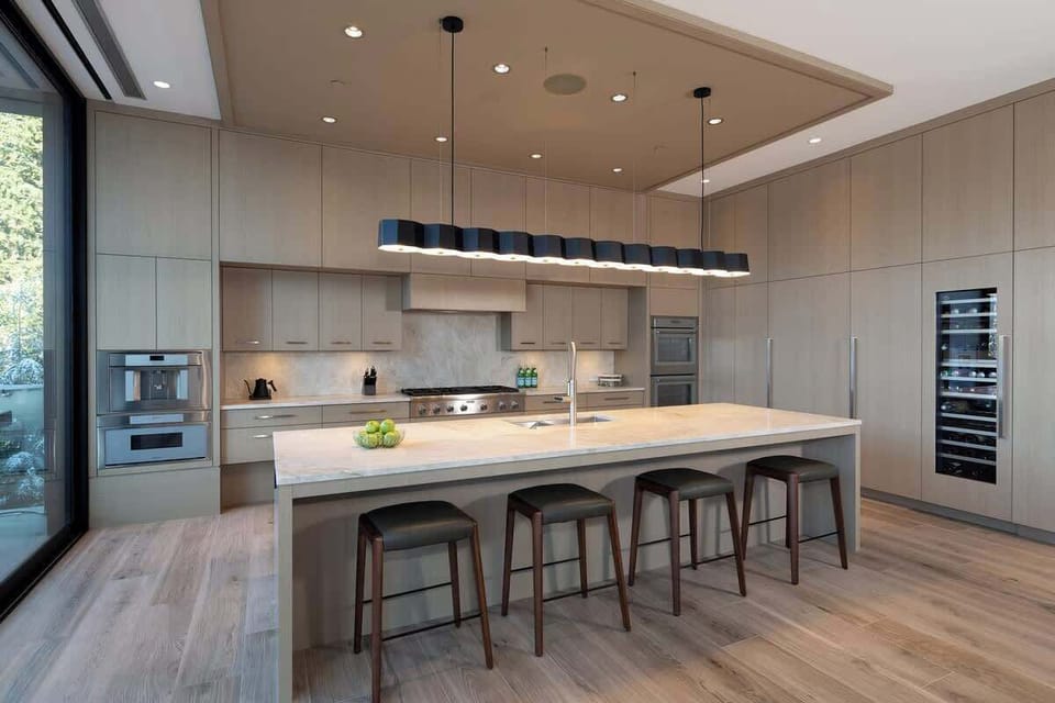 - Spacious kitchen island with bar seating and designer lighting  
- Fully equipped with high-end appliances and sleek modern finishes  
- Ideal layout for cooking, gathering, and sharing mountain meals  