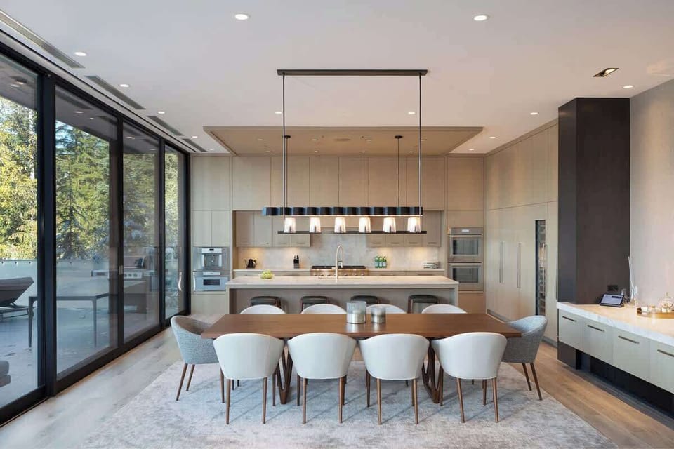 - Elegant dining area with seating for ten beside a chef’s kitchen  
- Floor-to-ceiling windows flood the space with natural mountain light  
- Ideal for hosting dinners in a warm and contemporary setting  
