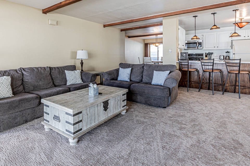 Comfortable seating includes a plush sofa and cozy loveseat, ideal for relaxing after a day of adventure.