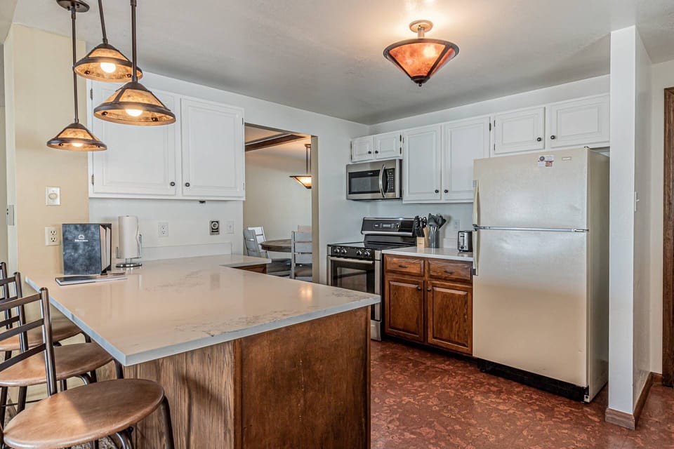 Spacious and well-equipped kitchen featuring ample counter space for all your culinary needs.