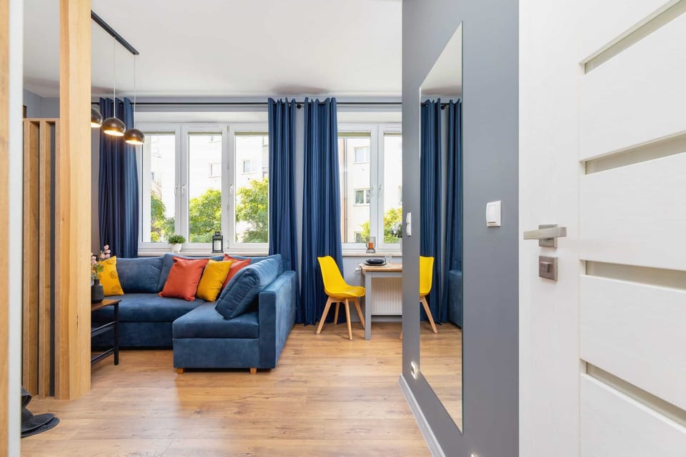 Another angle of the living room, highlighting its bright and airy layout with a view of the entire space.
