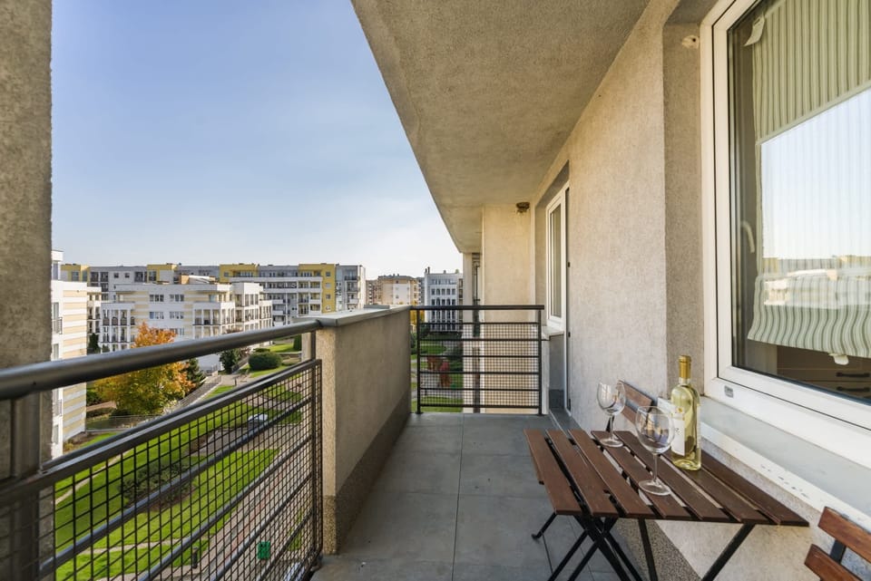 Another angle of the balcony, providing a broader perspective of the surrounding urban landscape.
