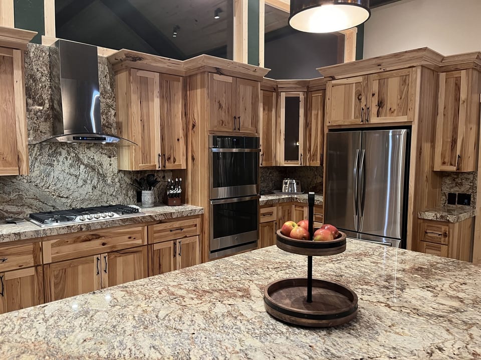 Large gourmet kitchen with dual refrigerator, oven.