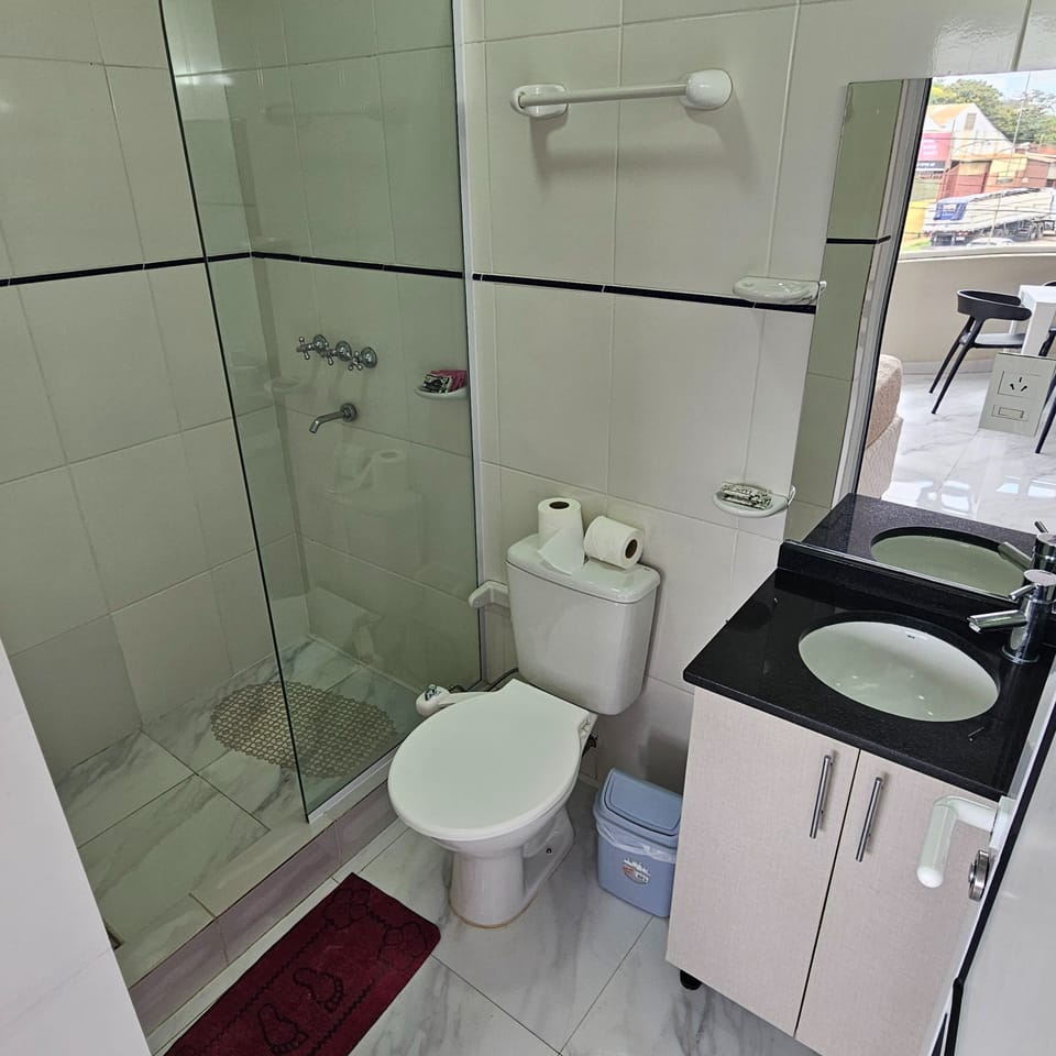 Deluxe Quadruple Room | Bathroom | Rainfall showerhead, electronic bidet, towels, soap