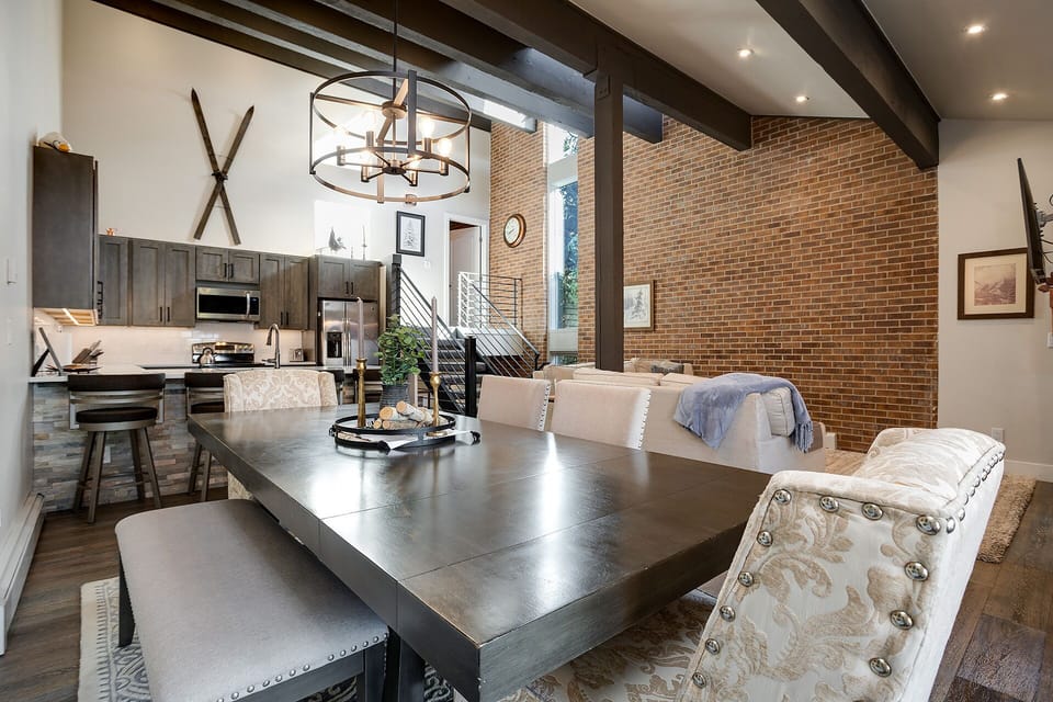 Gather around this striking dining table where industrial meets comfort in your stylish retreat.