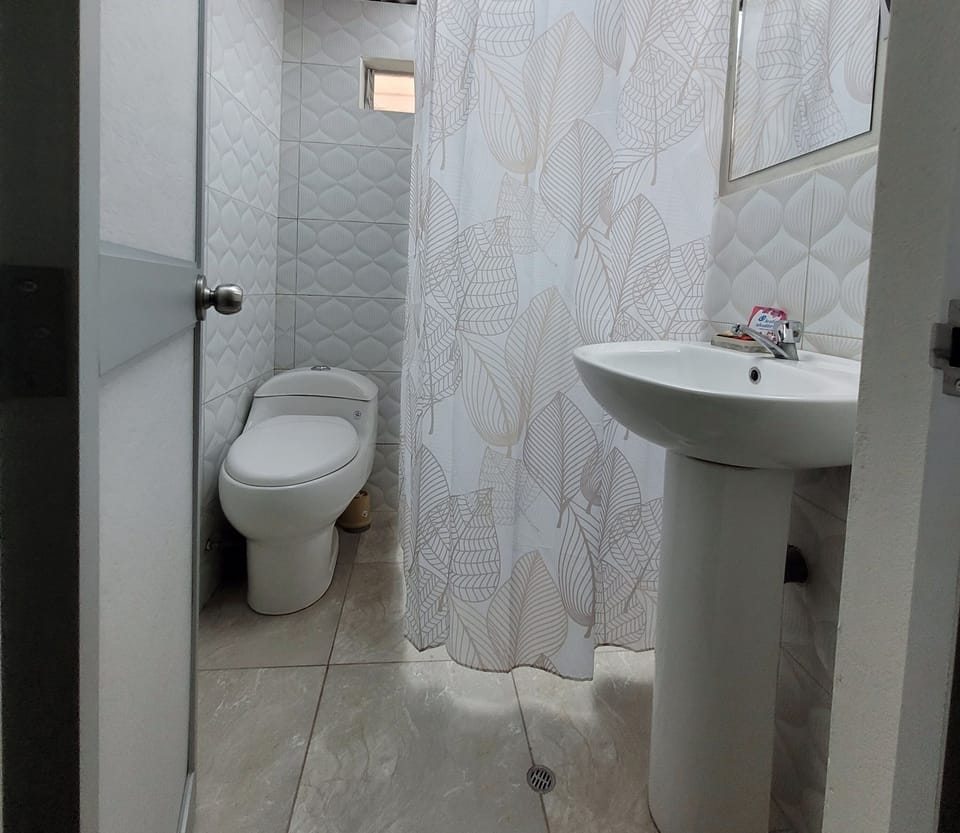 Family Apartment | Bathroom | Rainfall showerhead, hair dryer, towels, soap