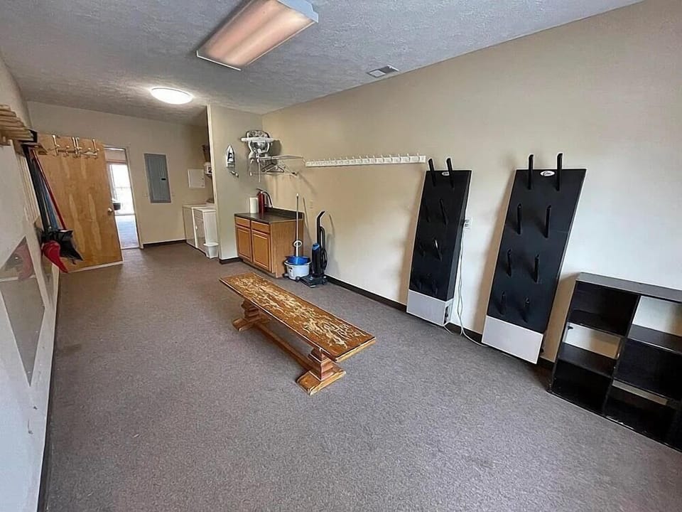 Our top of the line wet room - with industrial boot warmers, ski hangers, and tons of room for bikes. There's a bathroom with a shower off of this room as well.