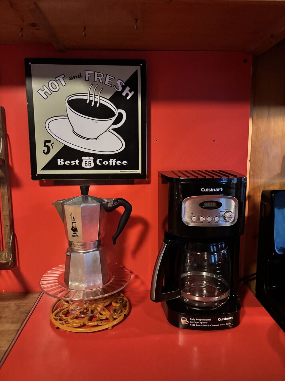Enjoy your morning brew in our thoughtfully designed kitchen, featuring a fully equipped coffee station with a drip coffee maker and moka pot.