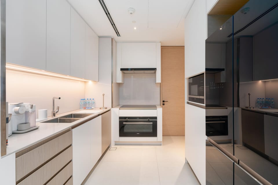 Signature Apartment | Private kitchen | Full-size fridge, microwave, oven, stovetop