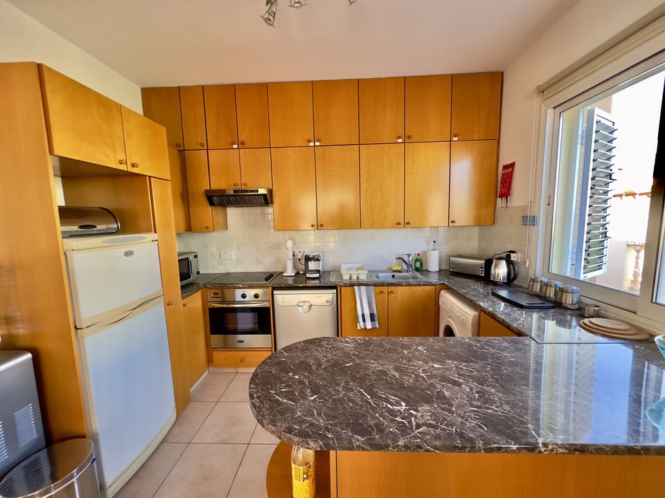 Whip up culinary delights in the well-equipped kitchen.