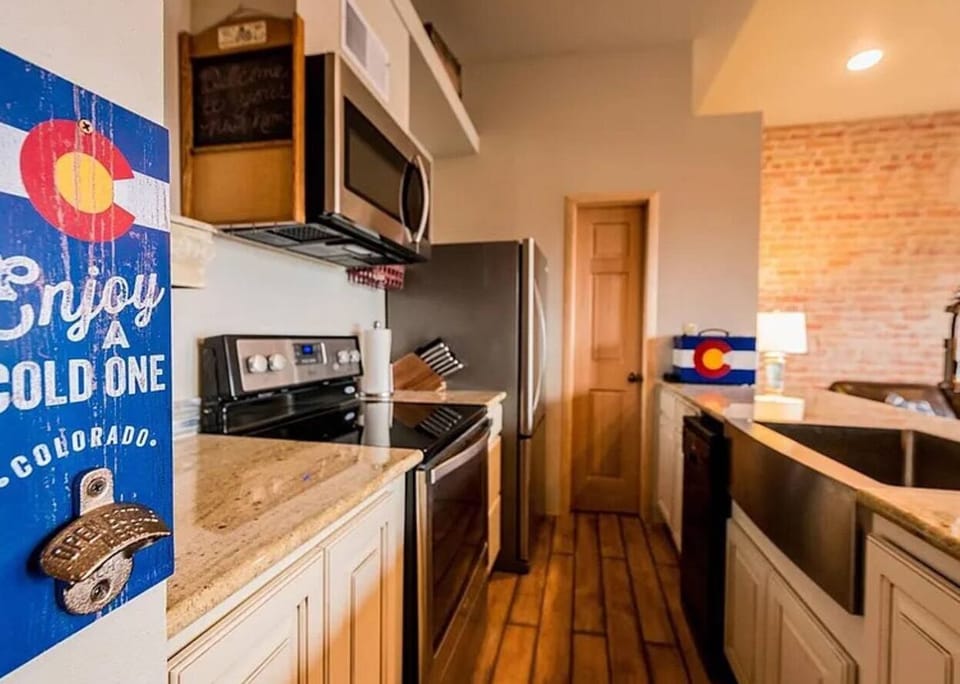 Enjoy the open living room and kitchen with 3 beautiful windows looking over F street. (4)