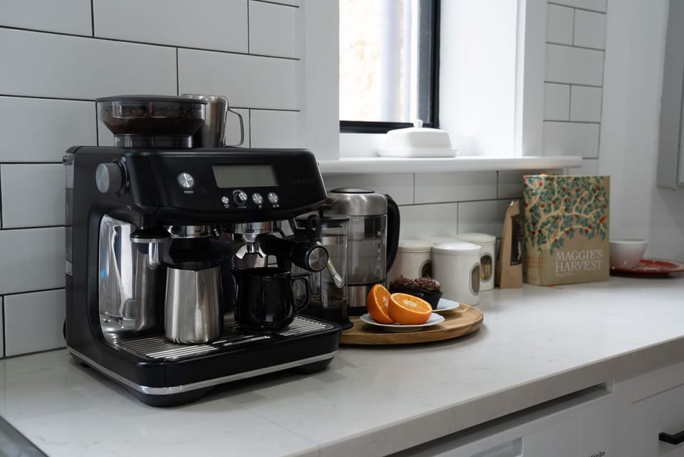 Shared fridge, microwave, espresso maker, coffee/tea maker