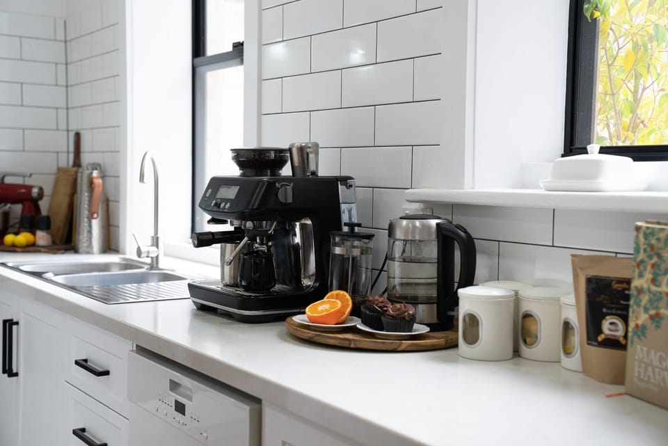 Shared fridge, microwave, espresso maker, coffee/tea maker