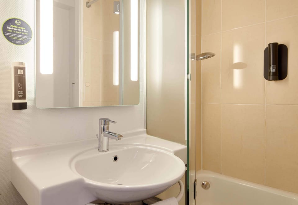 Shower, rainfall showerhead, hair dryer, towels