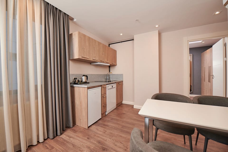 Family Suit Room With Kitchen | Private kitchen | Coffee/tea maker, electric kettle