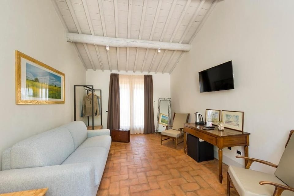 Deluxe Studio Suite, 1 Bedroom, Terrace, Sea View | Living area | 40-inch flat-screen TV with satellite channels, TV