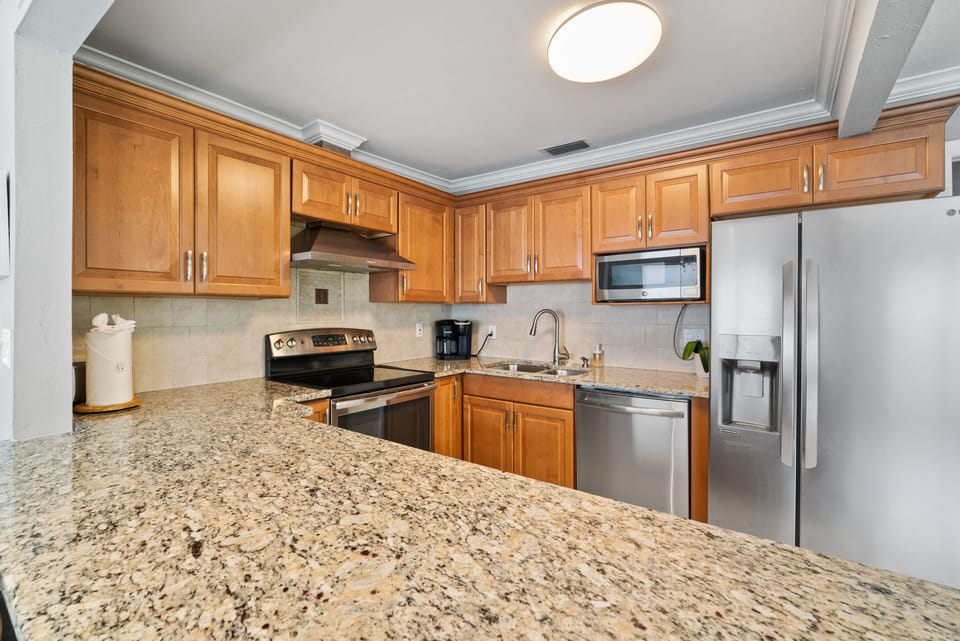 Granite countertops and oversized fridge