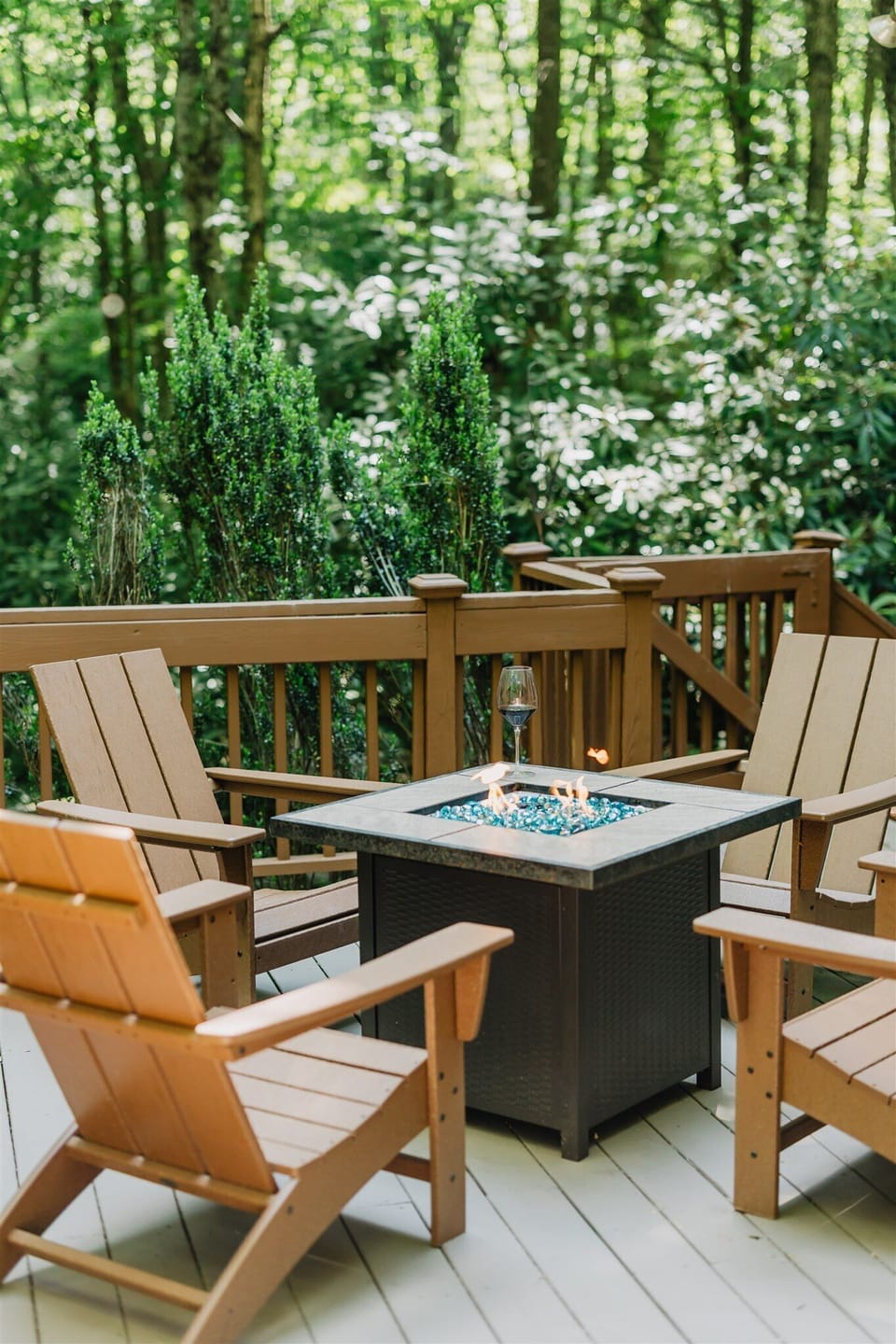 Enjoy a glass of wine by the gas fire pit on back deck