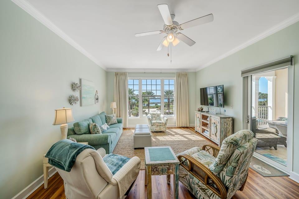 Living area with flat screen TV and sofa bed.