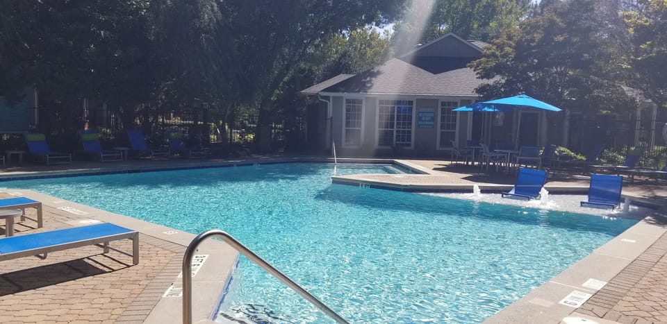 Beautiful Pool w/Water Falls & Lounge Chairs.