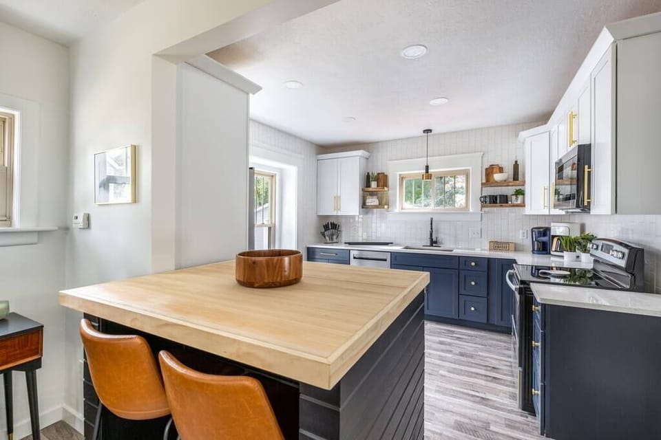 The wood slab on this custom breakfast bar has been repurposed from a local torn down bowling alley.