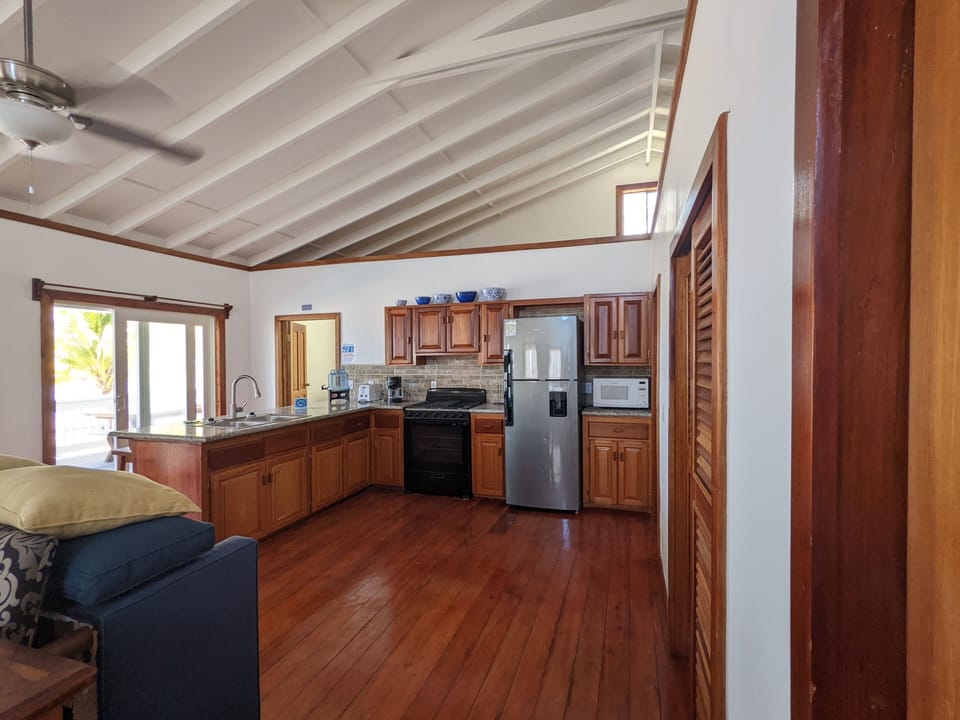 Upper level kitchen with Gorgeous hardwood floors. 