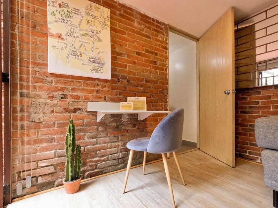 Comfort Apartment | Living area | Books, smart speakers, stereo