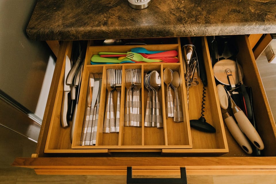 Dishware & flatware for 12+ guests, including kid-friendly utensils and other kitchen tools.