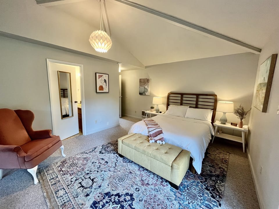 The guest suite has a private entrance on the main level, a queen sized bed, a private 3/4 bathroom.