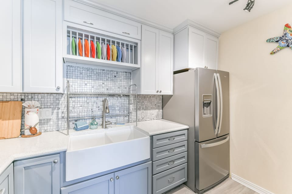 Kitchen includes  a split farmhouse sink and a sub zero refrigerator with ice maker