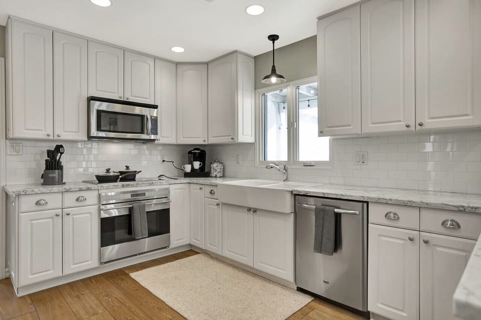 Alabaster-themed cabinets and stainless steel appliances!