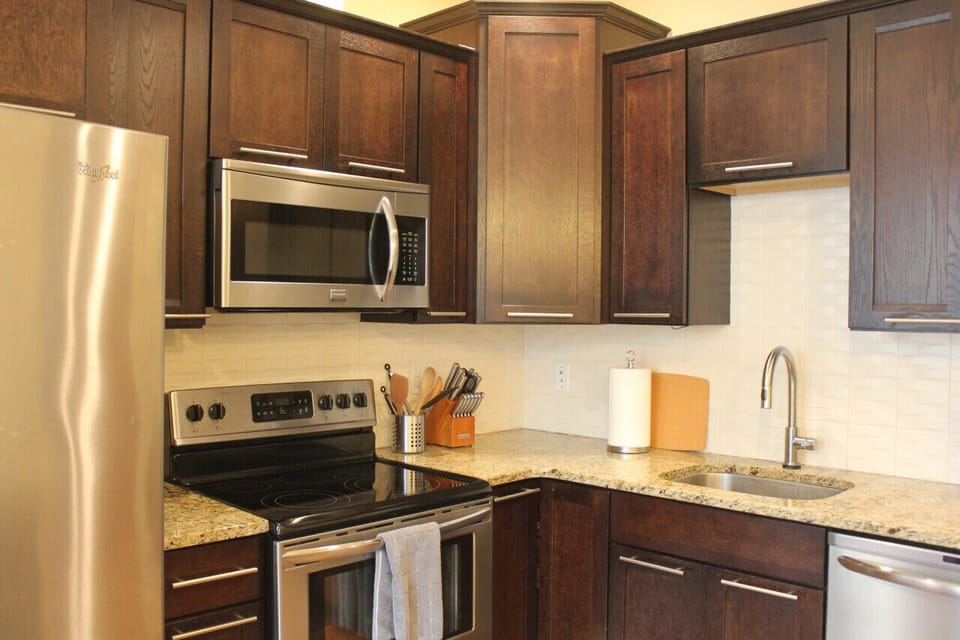 Experience the convenience and modernity of a fully equipped kitchen with sleek stainless steel appliances in our short-term rental. Step into a culinary haven where you can unleash your inner chef and create delicious meals.