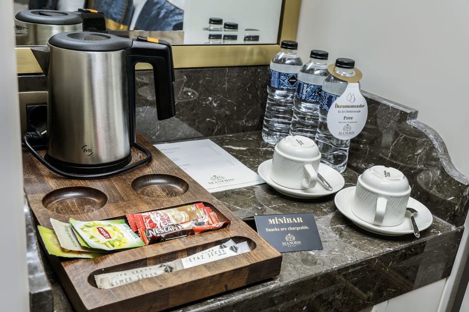 Premium bedding, down comforters, minibar, in-room safe