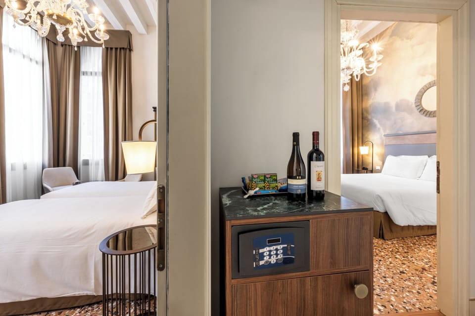Family Room | Down comforters, minibar, in-room safe, soundproofing