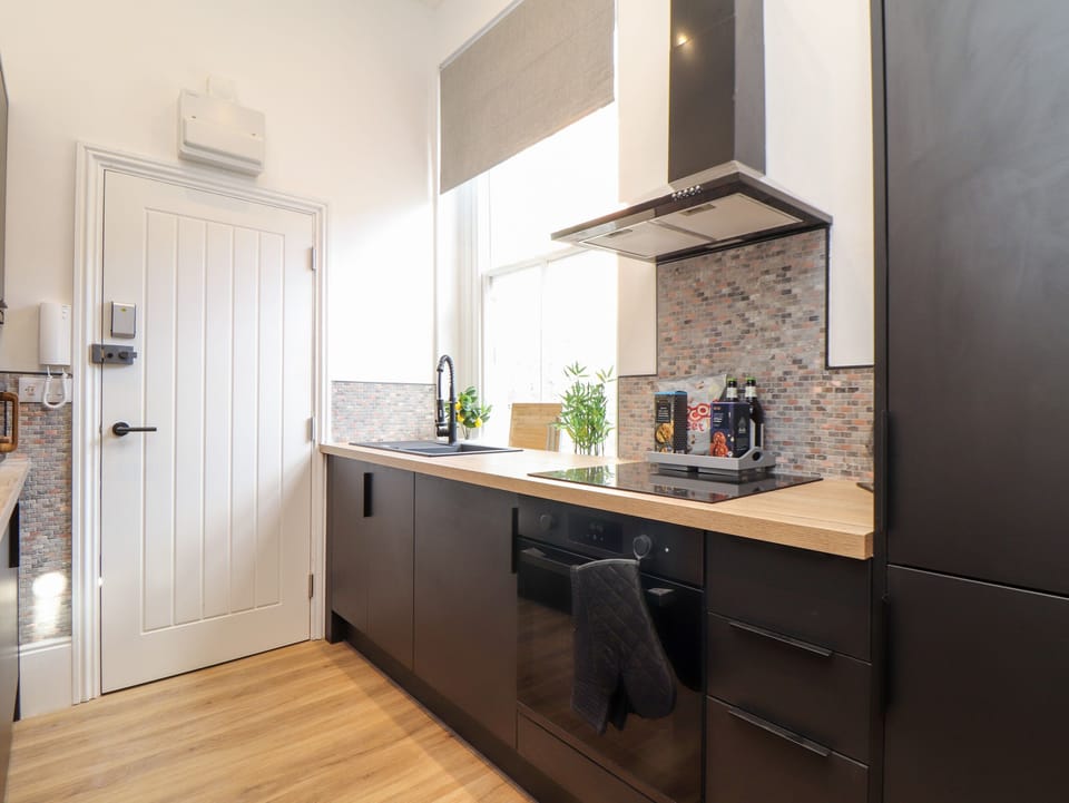 Fridge, electric kettle, cookware/dishes/utensils