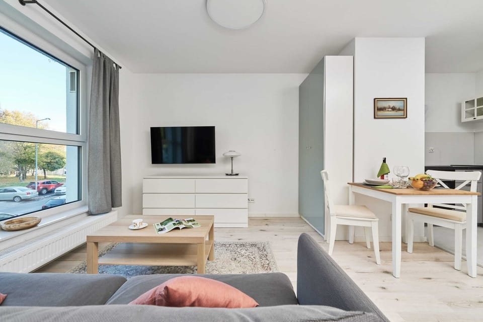 A wide view of the living space, blending comfort and modern decor.
