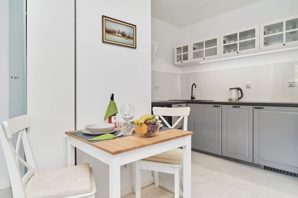 Another view of the kitchen and dining area, emphasizing its functionality and stylish design.
