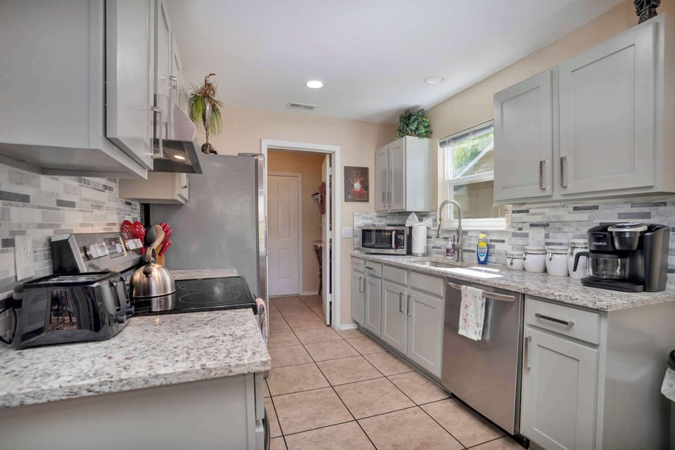 Inspire culinary artistry in this thoughtfully provisioned kitchen.